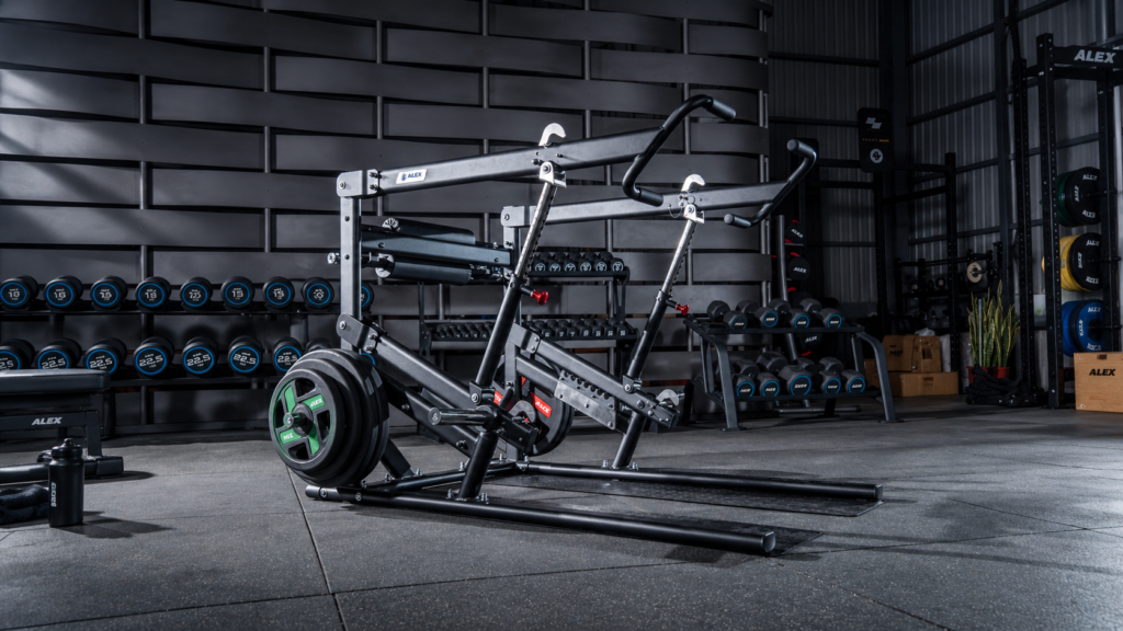Plate-loaded iso lateral chest press machine with independent arms in a commercial gym